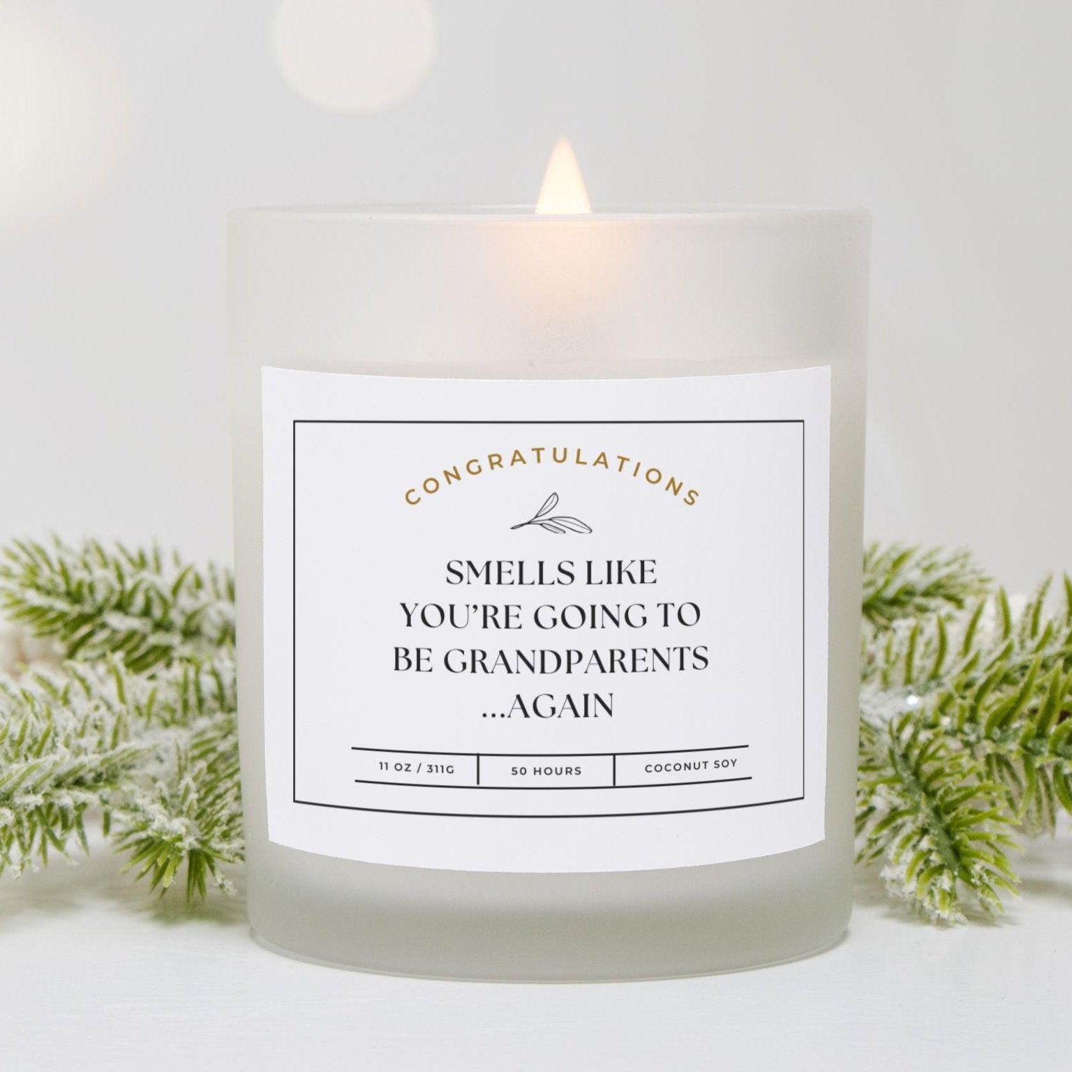 Frosted glass candle with "Smells Like You’re Going to Be Grandparents...Again" design.