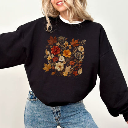 Fall floral sweatshirt with wildflower and autumn leaf design.