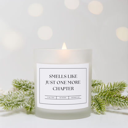 11 oz frosted glass candle with "Smells Like Just One More Chapter" design, perfect for book lovers and cozy nights.