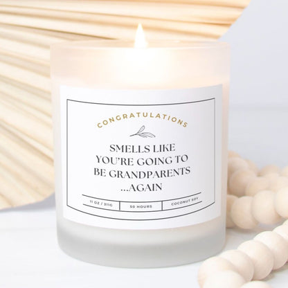 Frosted glass candle with "Smells Like You’re Going to Be Grandparents...Again" design.