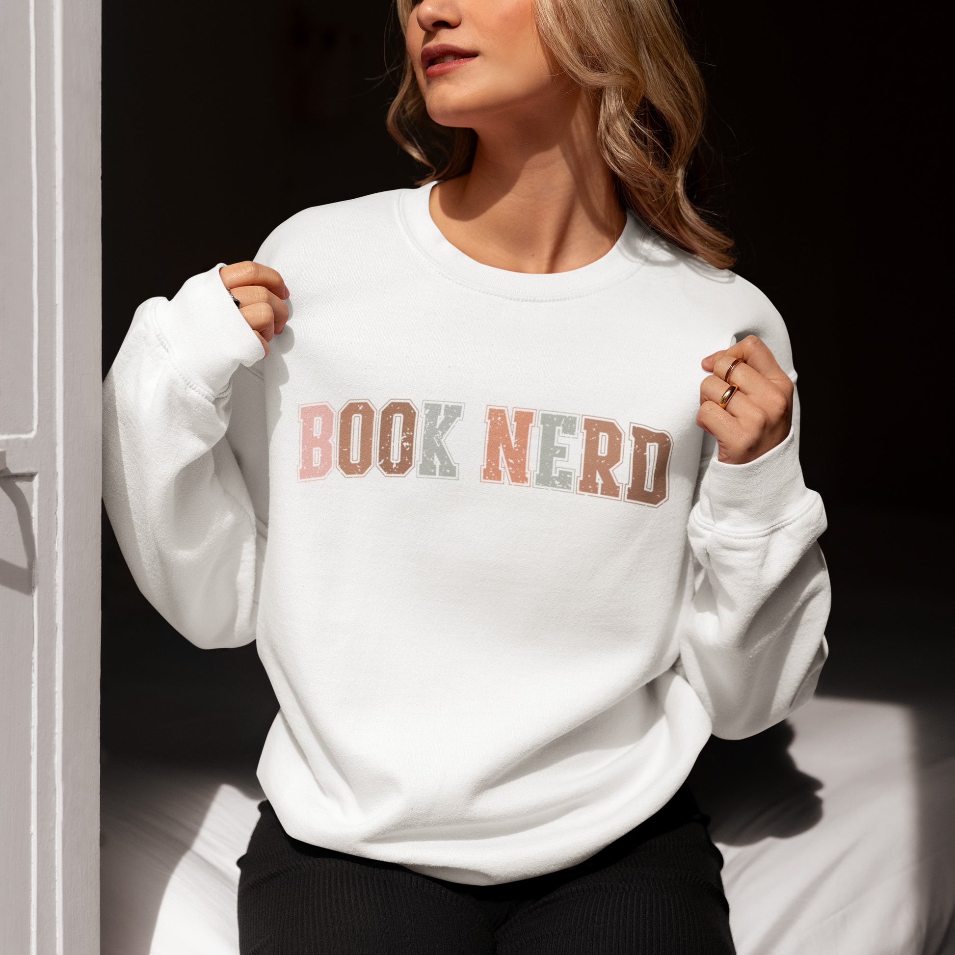 Cozy vintage-style book nerd sweatshirt with retro bookish design.