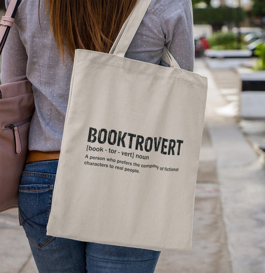 Book lover tote bag with 'Booktrovert' design for introverts and readers.