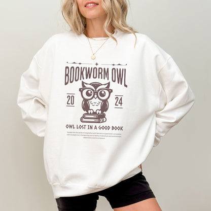 Bookworm sweatshirt with owl reading design for cozy book lovers, perfect literary apparel.