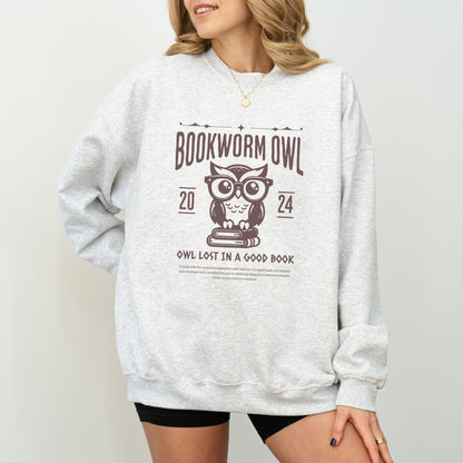 Bookworm sweatshirt with owl reading design for cozy book lovers, perfect literary apparel.