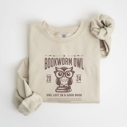 Bookworm sweatshirt with owl reading design for cozy book lovers, perfect literary apparel.