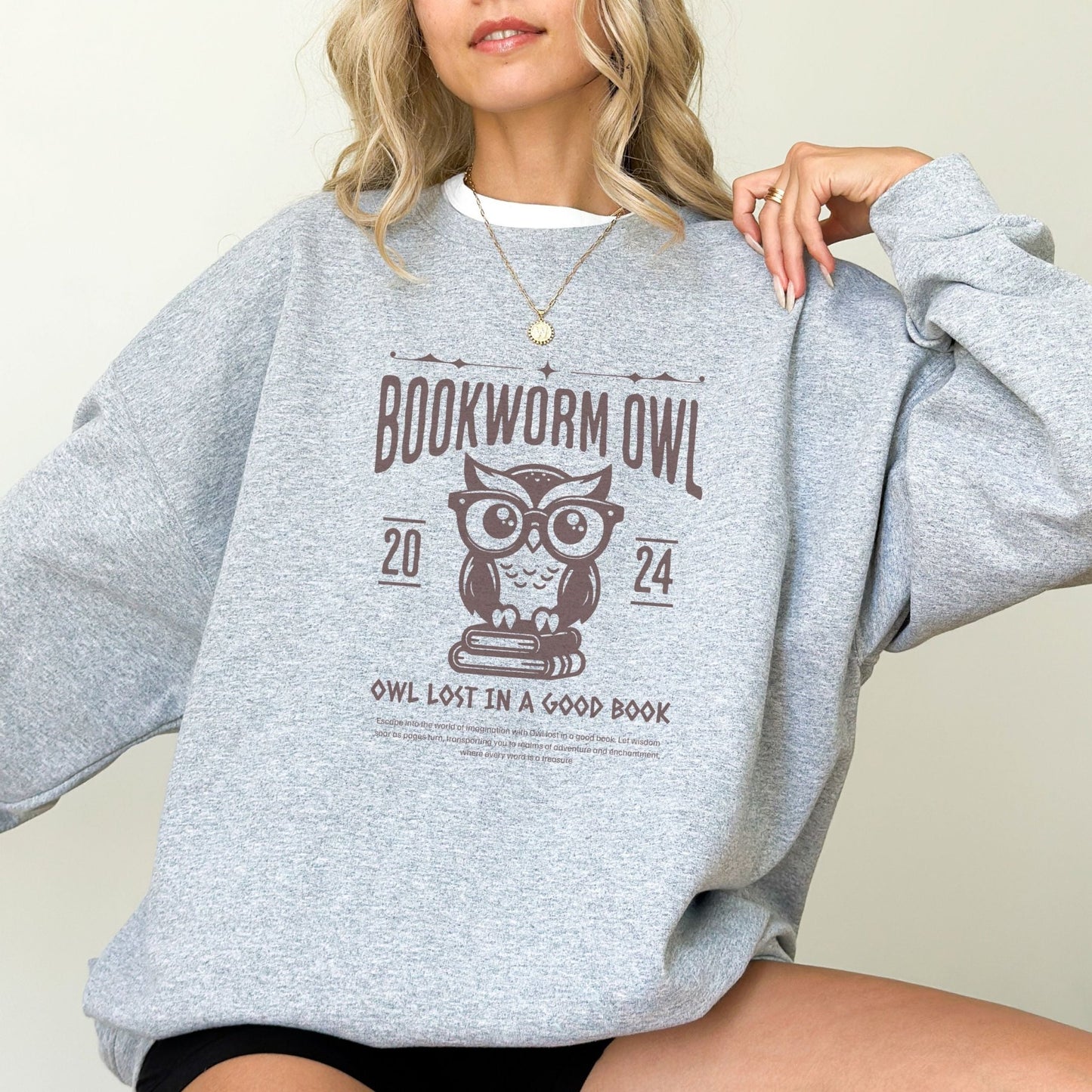 Bookworm sweatshirt with owl reading design for cozy book lovers, perfect literary apparel.