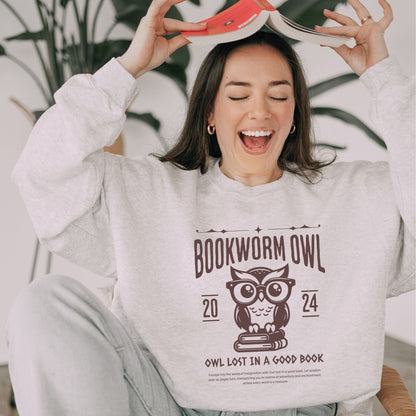 Bookworm sweatshirt with owl reading design for cozy book lovers, perfect literary apparel.