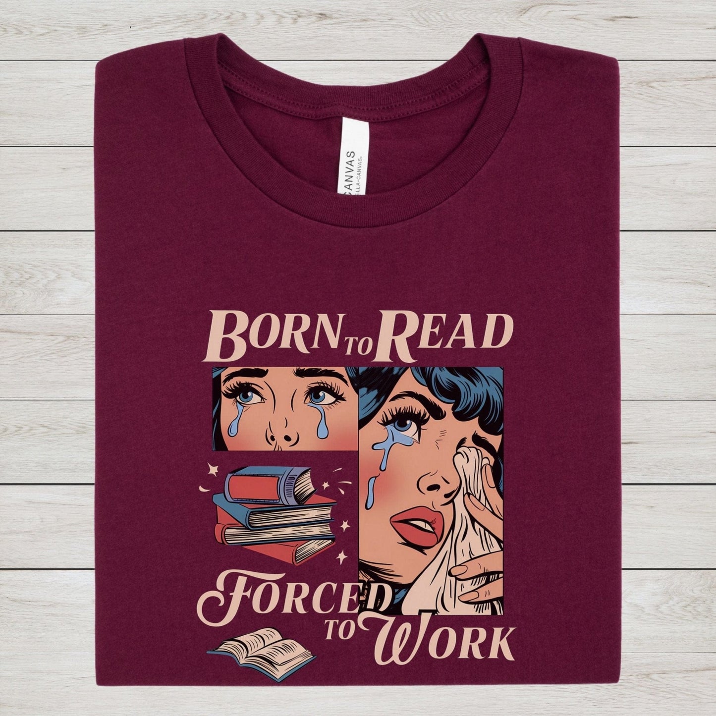 Comic-style “Born to Read, Forced to Work” t-shirt with crying girl, stacked books, and vintage pop-art design.