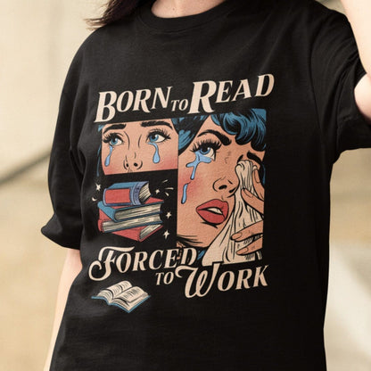 Comic-style “Born to Read, Forced to Work” t-shirt with crying girl, stacked books, and vintage pop-art design.