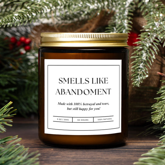 Amber jar candle with "Smells Like Abandonment" design, perfect for funny and quirky gift occasions.