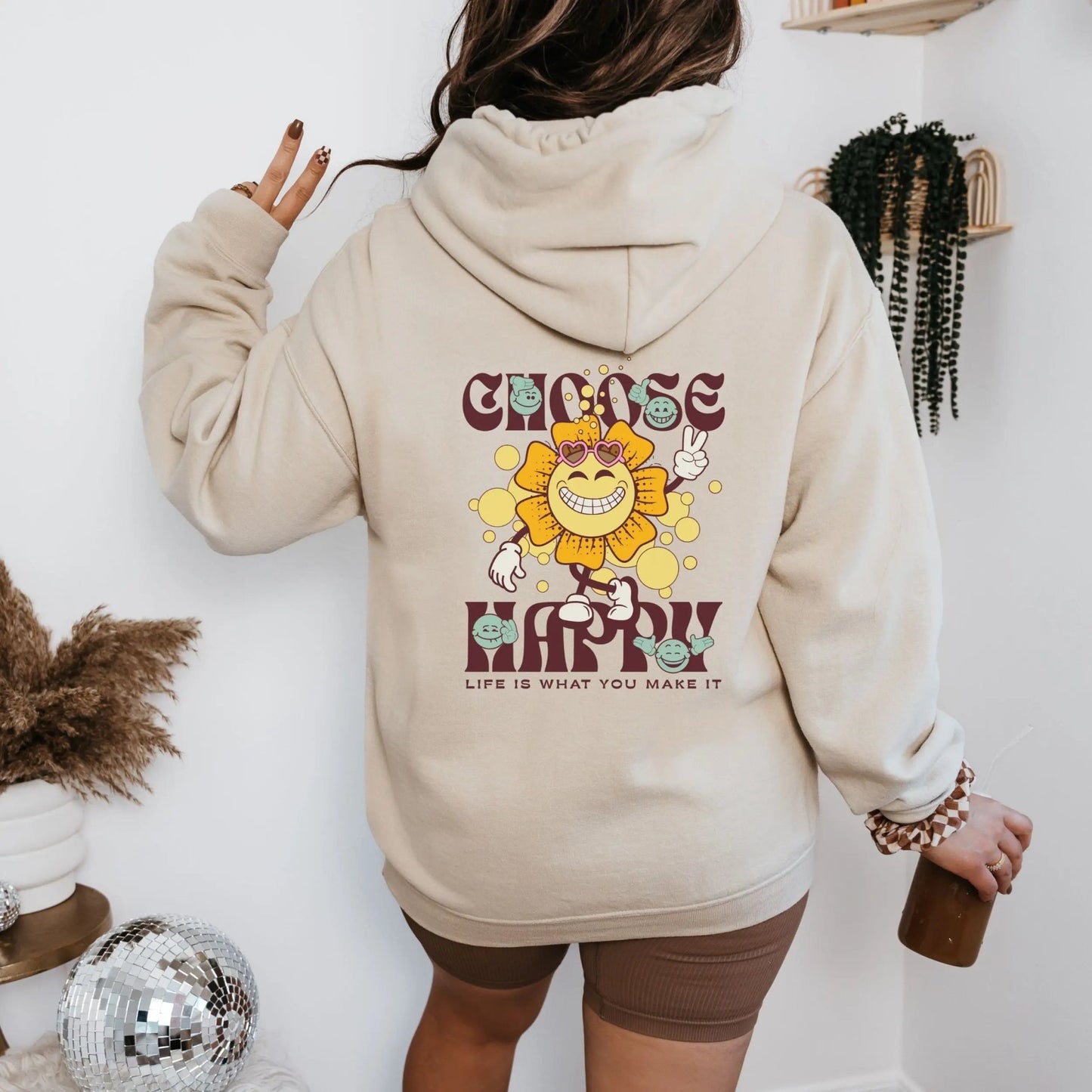 Choose Happy hoodie with retro sunflower design, perfect for positive vibes and feel-good fashion.