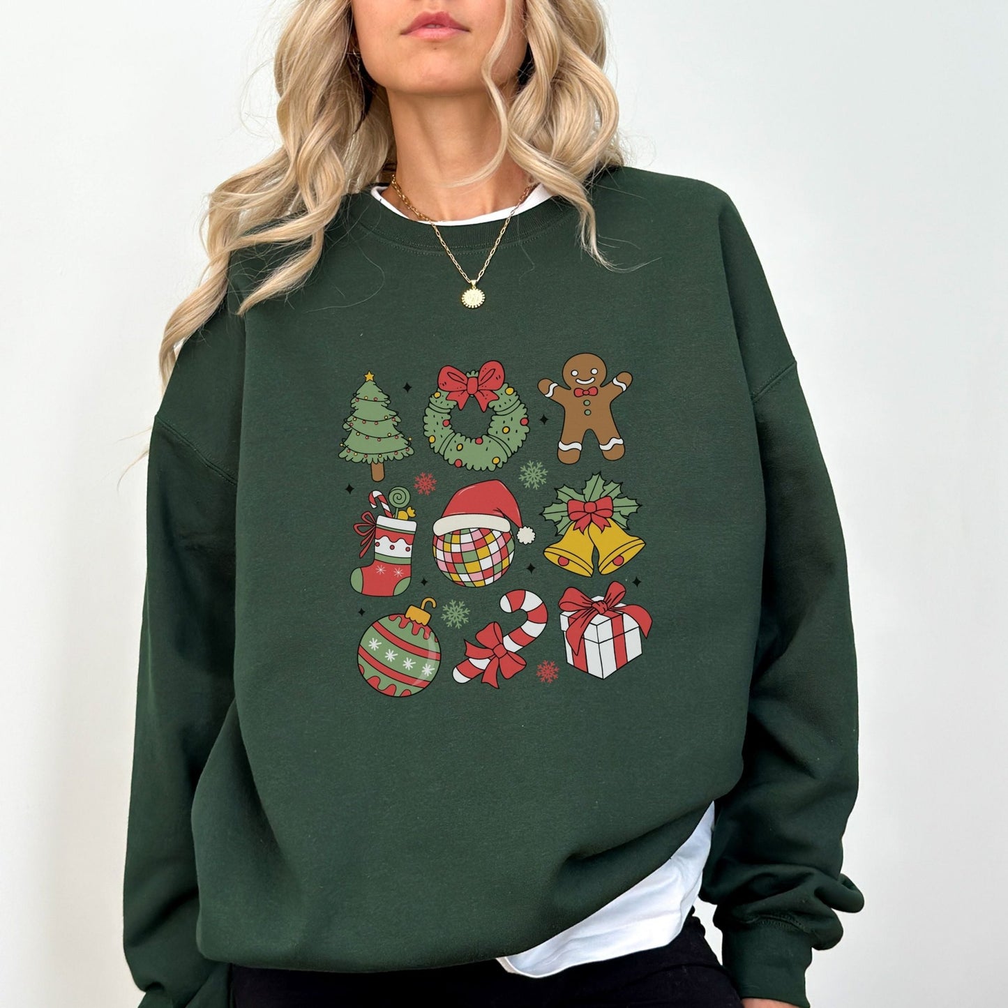 Christmas sweatshirt with festive holiday icons like trees, wreaths, and gingerbread men. Comes in 6 colors, perfect for cozy winter wear.