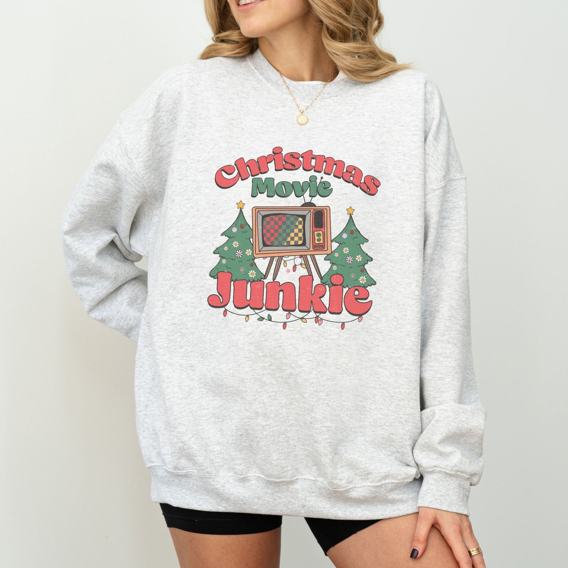 Retro Christmas movie sweatshirt with TV and holiday tree design, ideal for Christmas movie fans and cozy holiday wear.