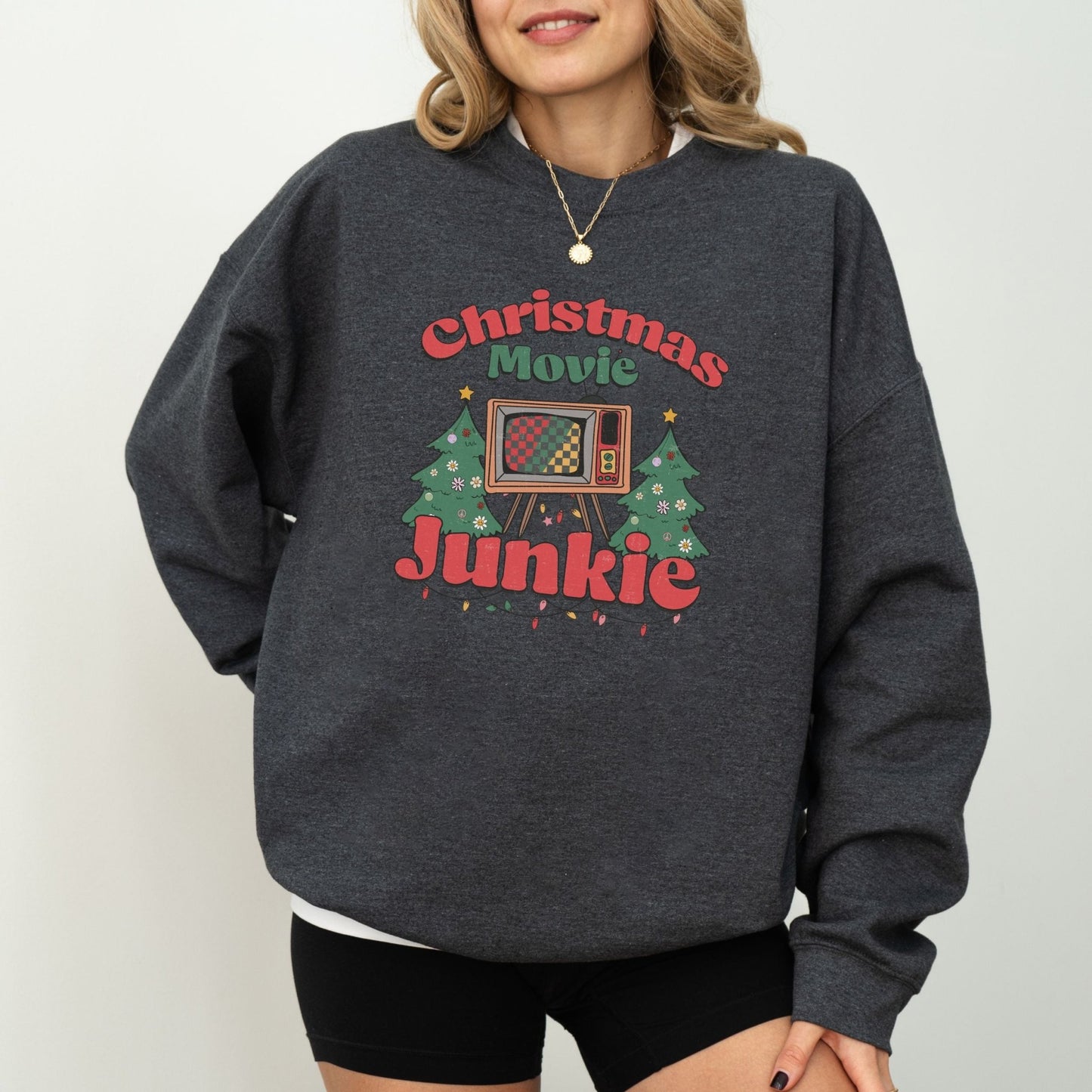 Retro Christmas movie sweatshirt with TV and holiday tree design, ideal for Christmas movie fans and cozy holiday wear.