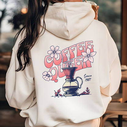 Retro-style “Coffee Queen” text with floral accents and a coffee pour-over illustration on back of a hoodie