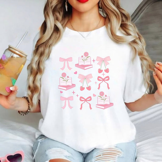 Coquette aesthetic shirt with pink bow and book design, perfect for soft girl style.