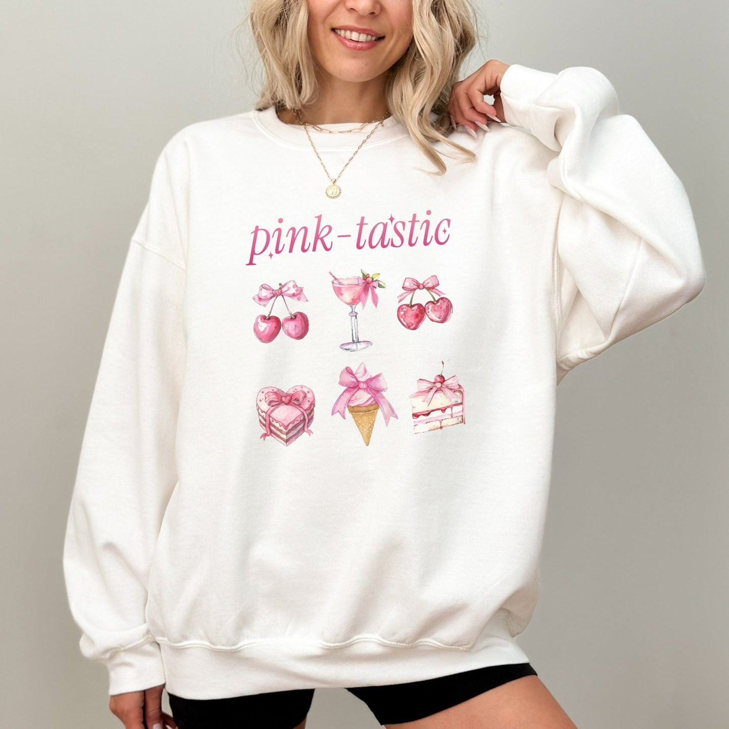 Pink-tastic sweatshirt with a feminine design featuring pink cherries, desserts, and a cocktail.