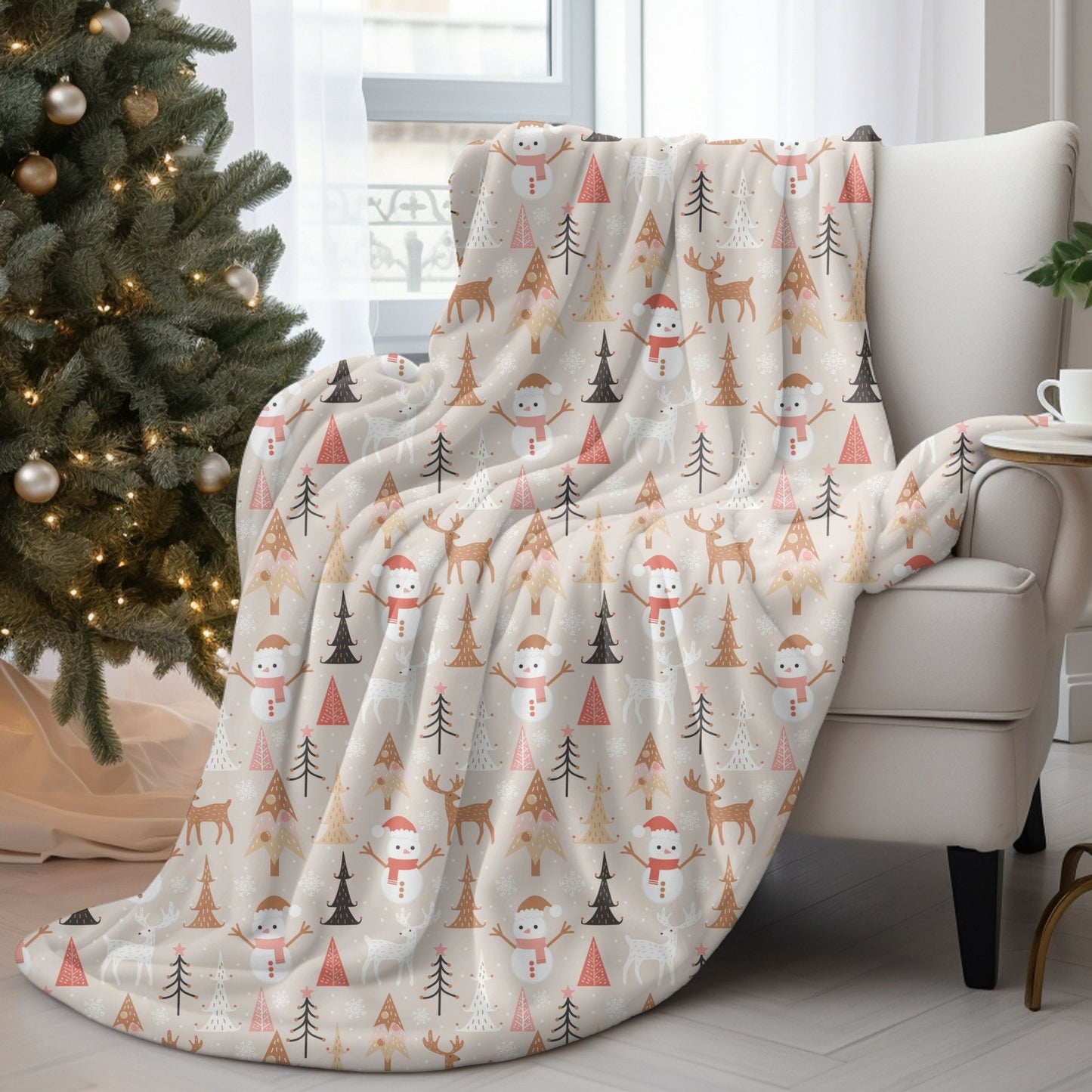 Cozy Christmas blanket with reindeer, snowman, and tree designs, perfect for holiday decor.