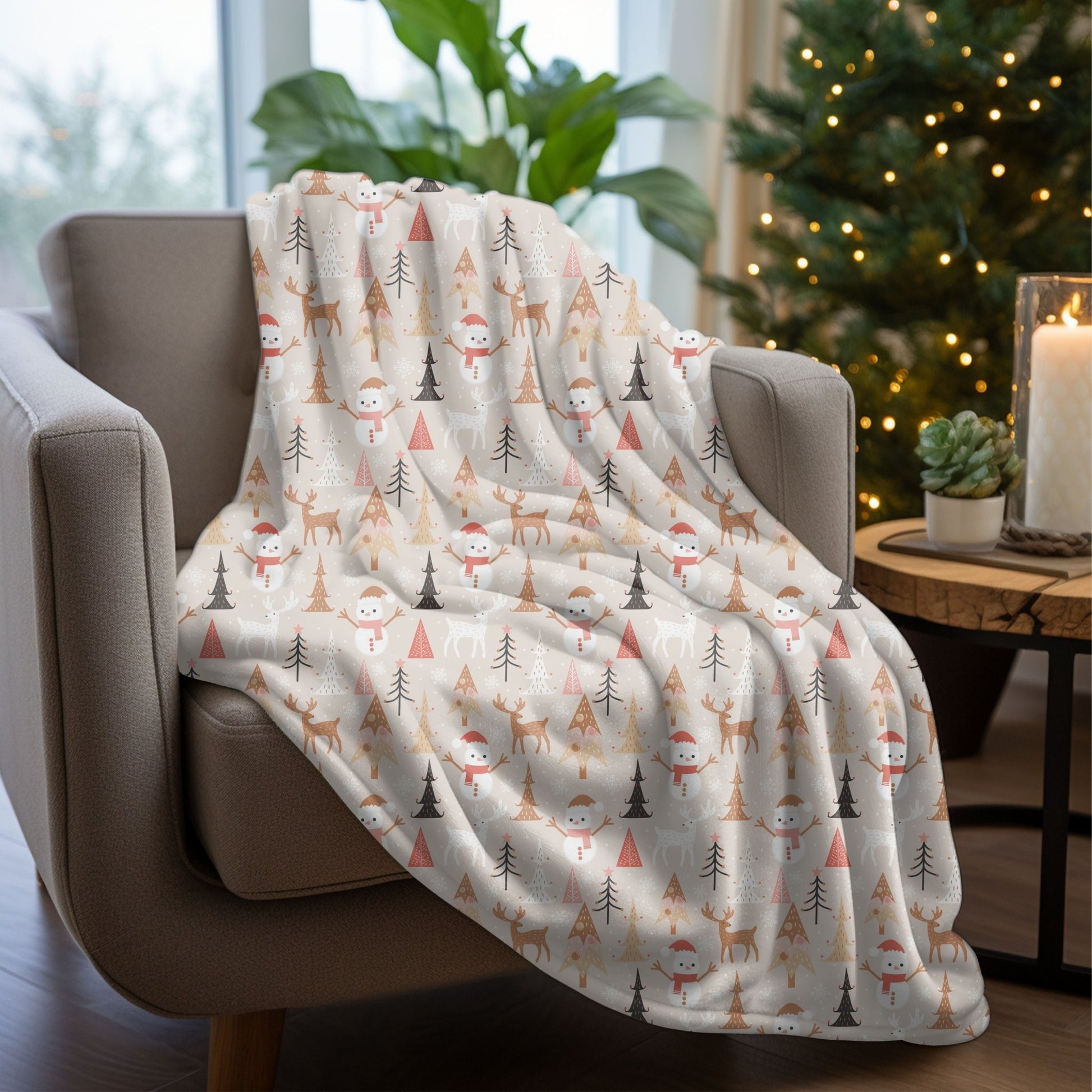 Cozy Christmas blanket with reindeer, snowman, and tree designs, perfect for holiday decor.