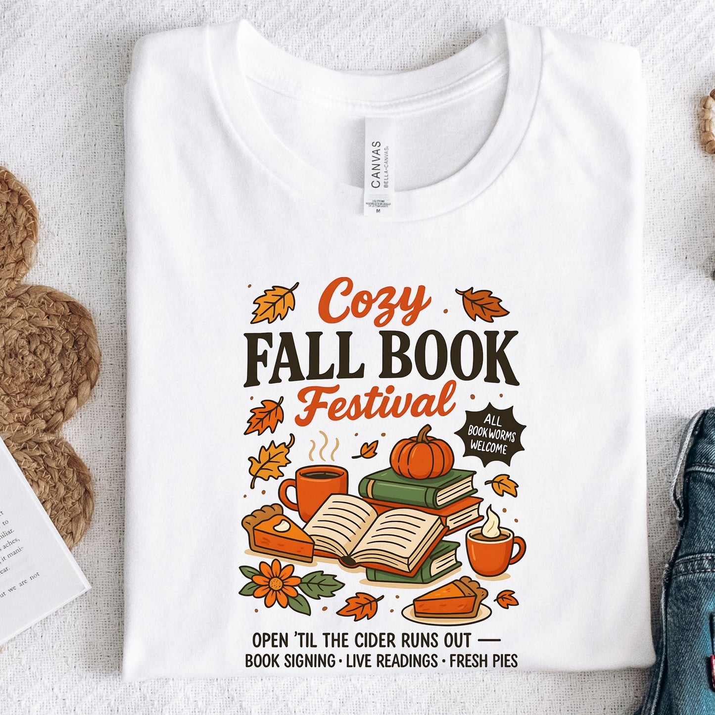 Cozy Fall Book Festival t-shirt with books, pumpkin pie, cider mugs, and autumn leaves in retro fall colors.