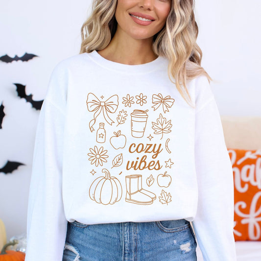 Cozy Vibes fall aesthetic sweatshirt with bows, pumpkins, coffee cup, and autumn leaves