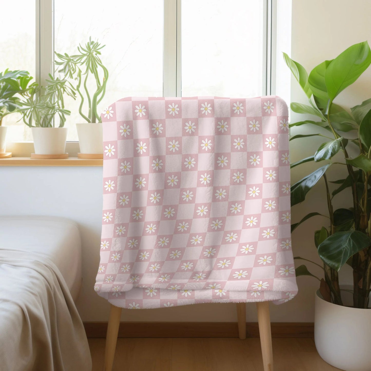 Boho chic blanket with checkered and flower design, available in green, orange, and pink.