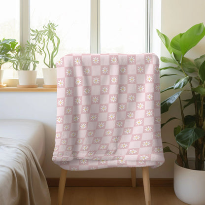 Boho chic blanket with checkered and flower design, available in green, orange, and pink.