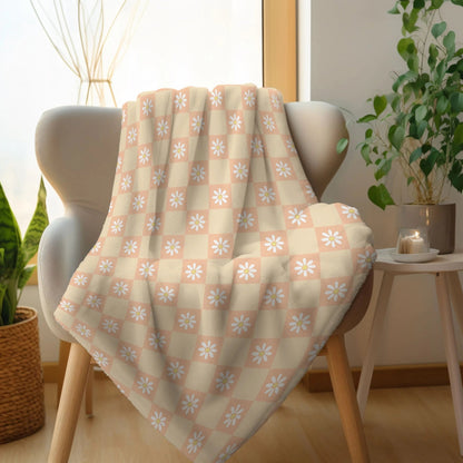 Boho chic blanket with checkered and flower design, available in green, orange, and pink.