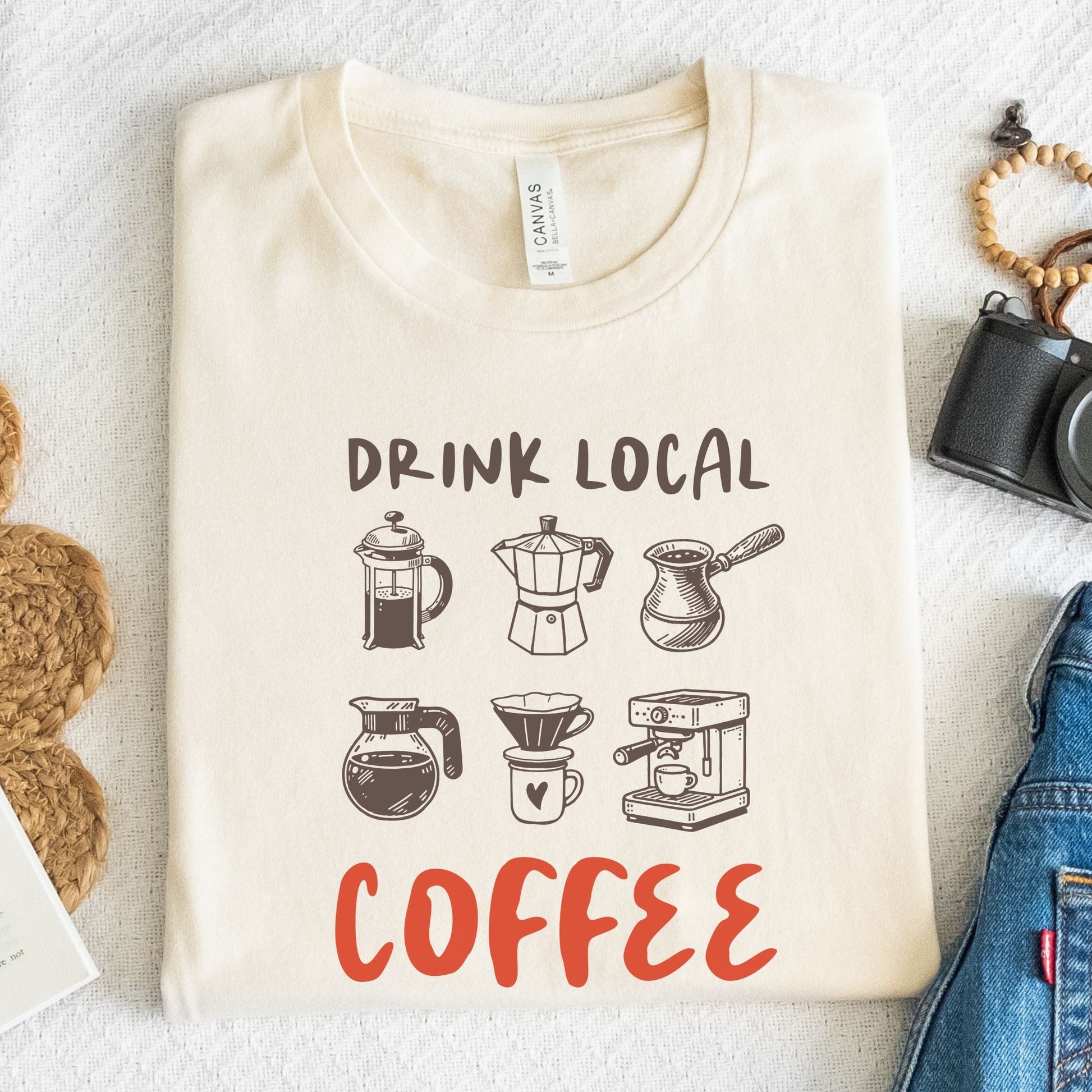 T-Shirt with hand-drawn moka pot, espresso maker, and pour-over with text “Drink Local Coffee”