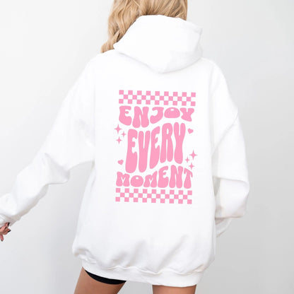 Enjoy Every Moment hoodie with retro checkerboard design, perfect for positive fashion and groovy vibes.