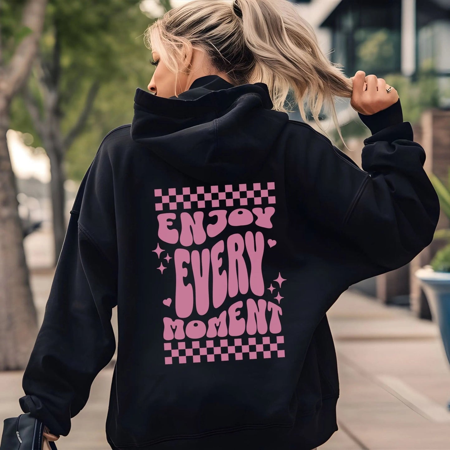 Enjoy Every Moment hoodie with retro checkerboard design, perfect for positive fashion and groovy vibes.