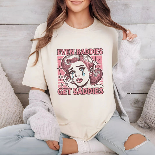 Even Baddies Get Saddies pop-art t-shirt with retro vibes, available in 3 colors.