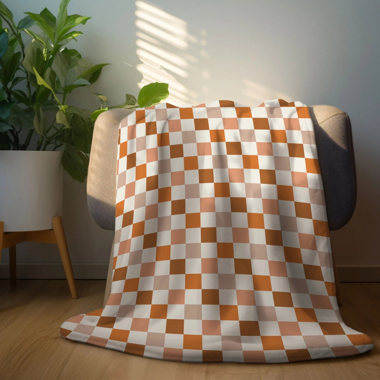 Checkered fall-themed plush blanket in warm autumn colors, perfect for cozy décor.