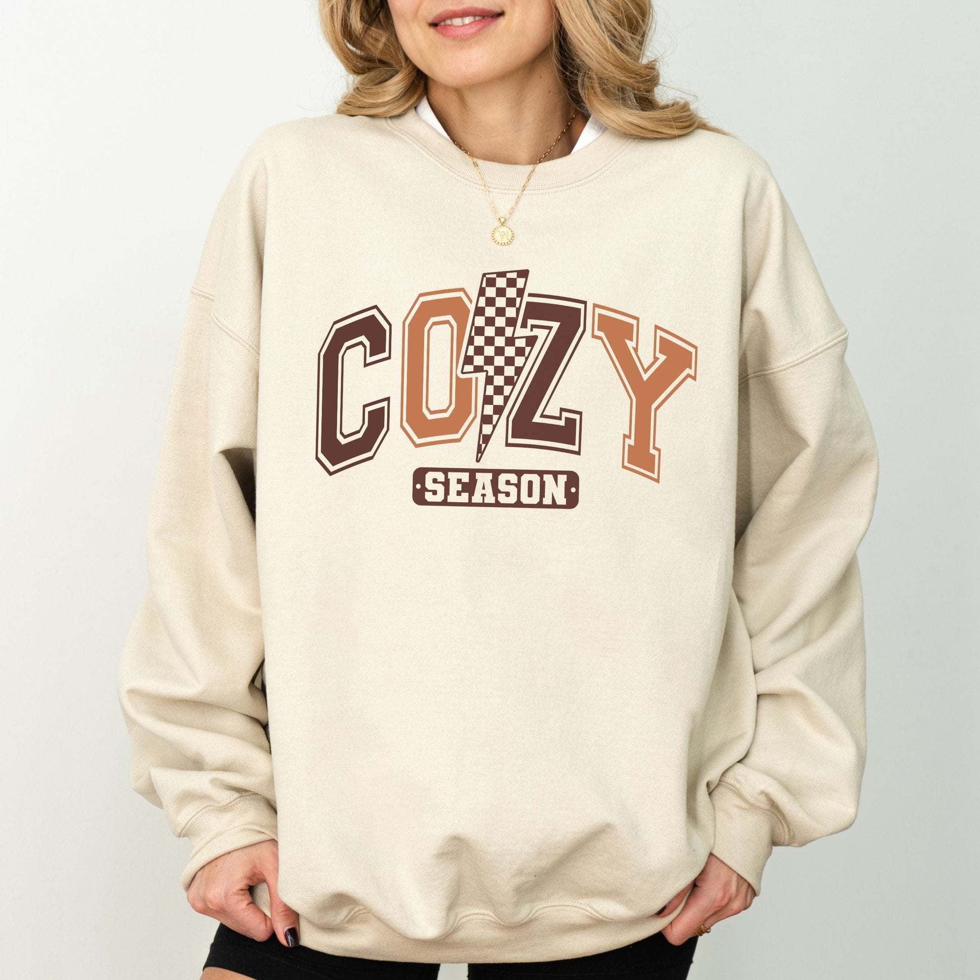 Cozy Season sweatshirt with retro varsity lettering in warm brown tones