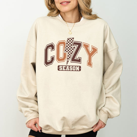 Cozy Season sweatshirt with retro varsity lettering in warm brown tones