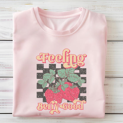 Vintage strawberry graphic t-shirt with retro font and checkerboard background, perfect for summer outfits and fruit lovers