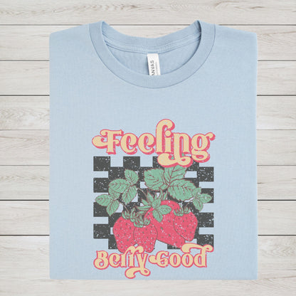 Vintage strawberry graphic t-shirt with retro font and checkerboard background, perfect for summer outfits and fruit lovers