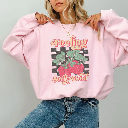 "Feeling Berry Good" sweatshirt with strawberry design, cozy blend, 9 colors, cute and playful.