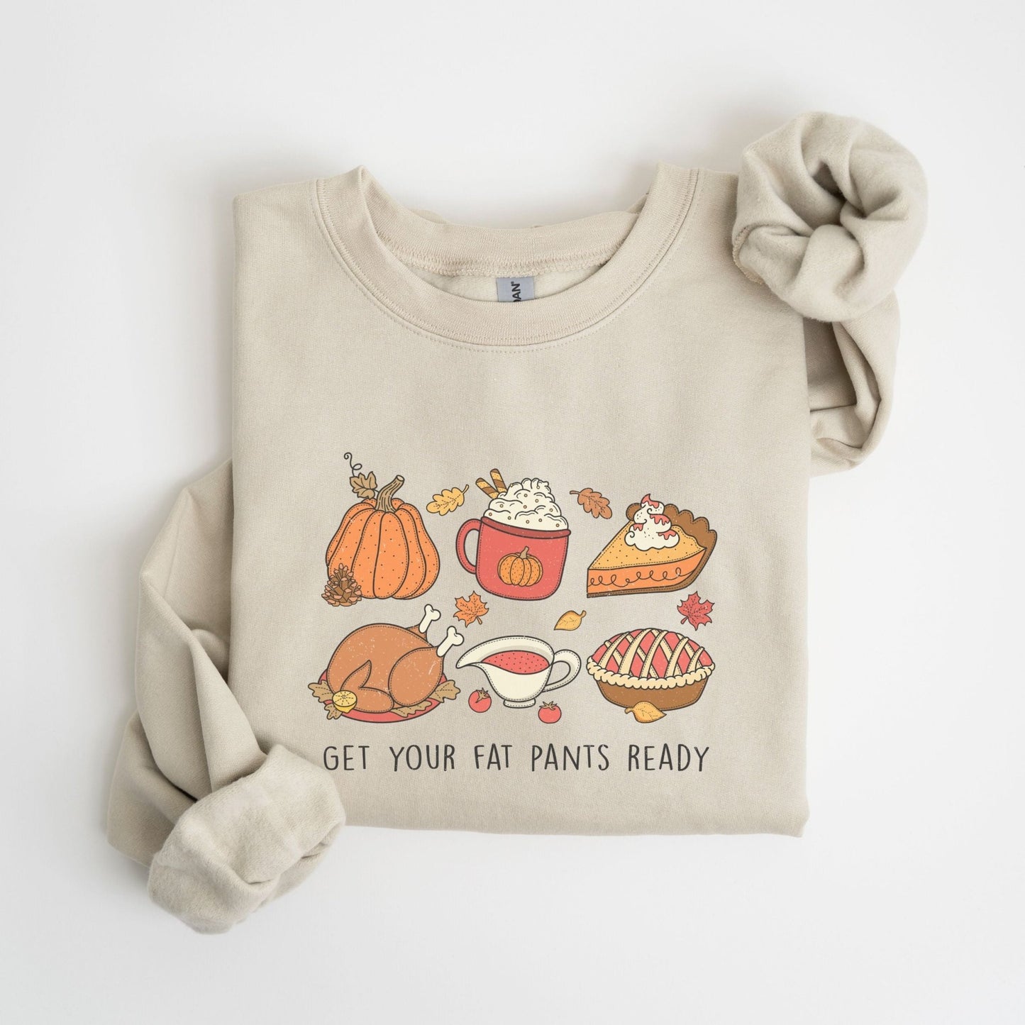 Thanksgiving sweatshirt with a festive food design and "Get Your Fat Pants Ready" text.