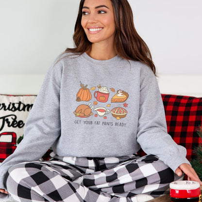 Thanksgiving sweatshirt with a festive food design and "Get Your Fat Pants Ready" text.