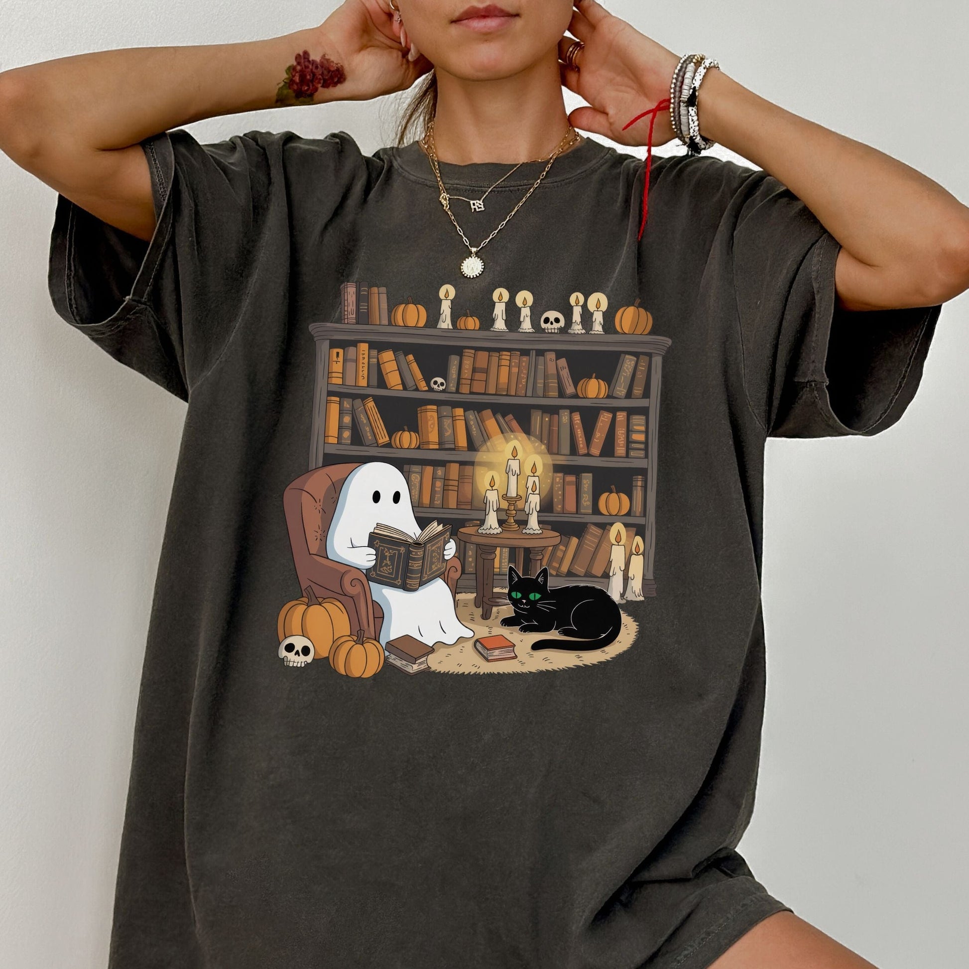 Cute ghost reading a book in a cozy library with pumpkins, candles, and a black cat for Halloween.