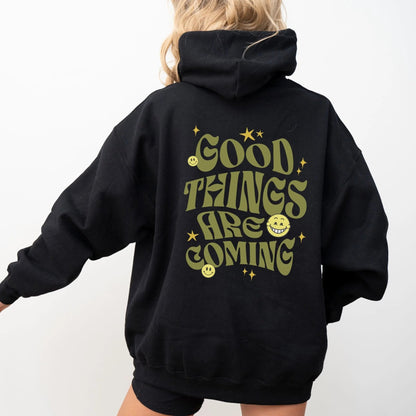 Good Things Are Coming hoodie, Y2K-inspired streetwear, retro typography, smiley faces.