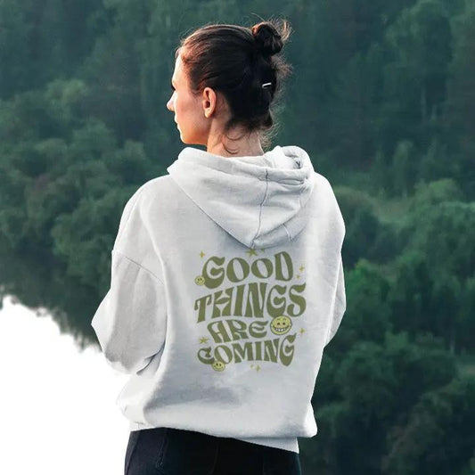 Good Things Are Coming hoodie, Y2K-inspired streetwear, retro typography, smiley faces.