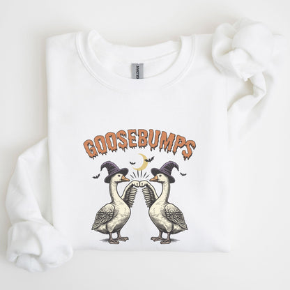 Halloween sweatshirt with two geese in witch hats bumping wings under a crescent moon — spooky and fun fall apparel.