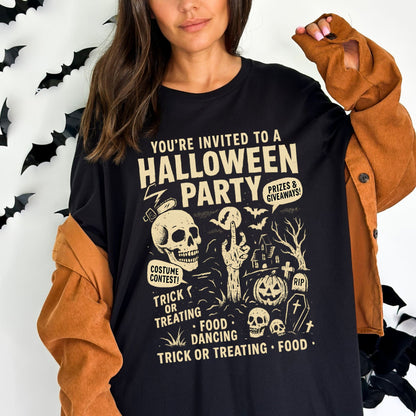 Retro Halloween party skeleton graphic tee with spooky cartoon skulls, tombstones, and vintage lettering