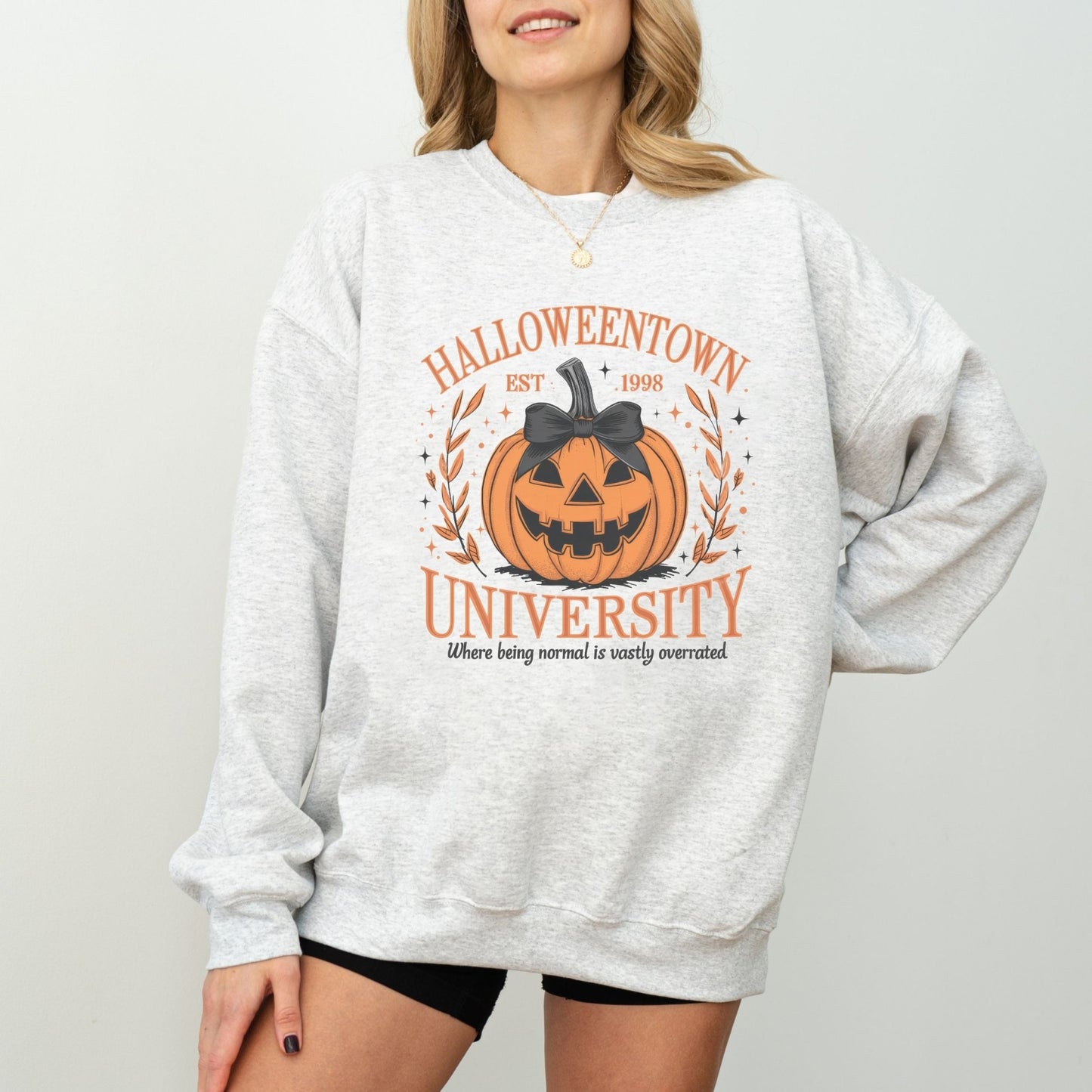 Halloweentown University sweatshirt with a spooky pumpkin design.