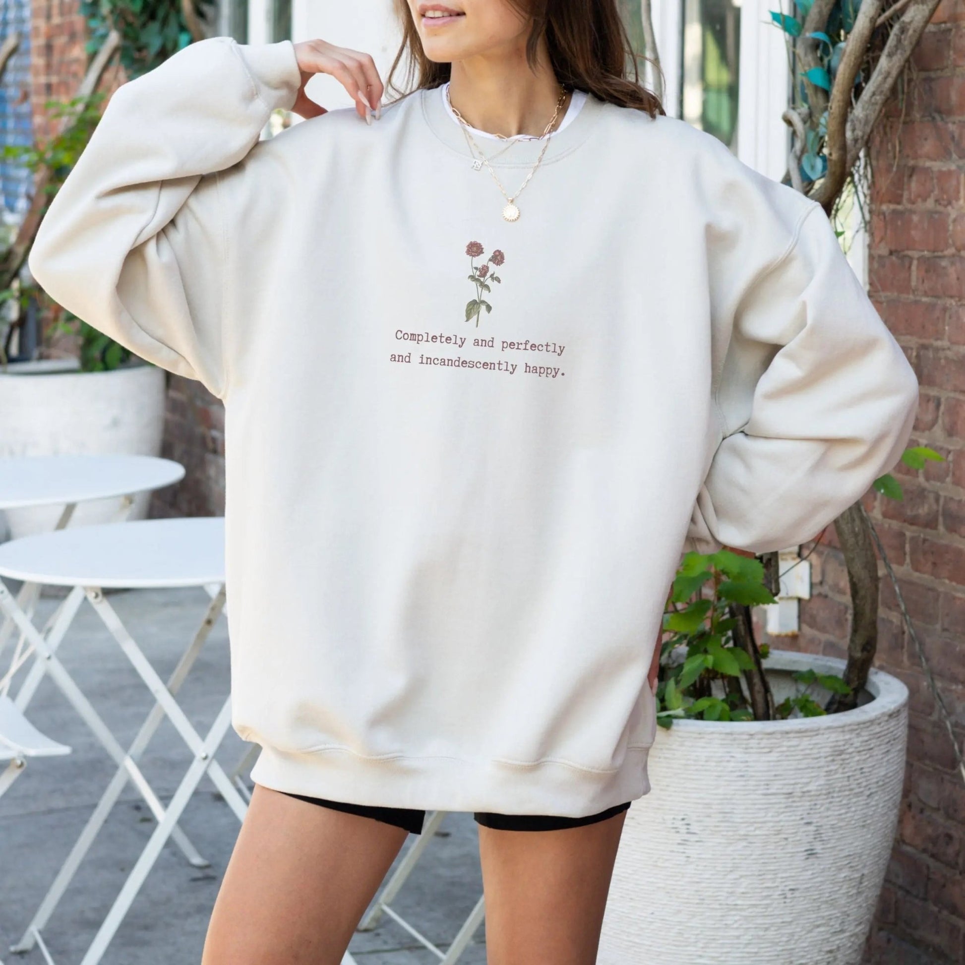 Cozy sweatshirt with Jane Austen quote and floral design, perfect literary gift.