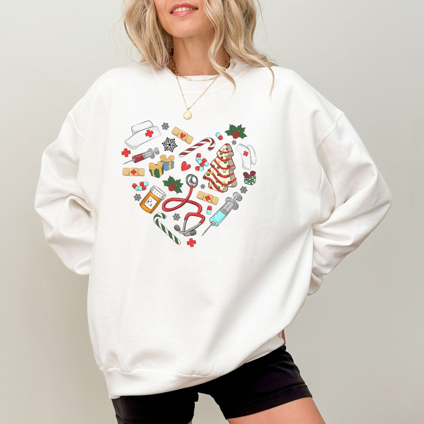 Nurse Christmas sweatshirt with holiday-themed medical icons in a heart shape.