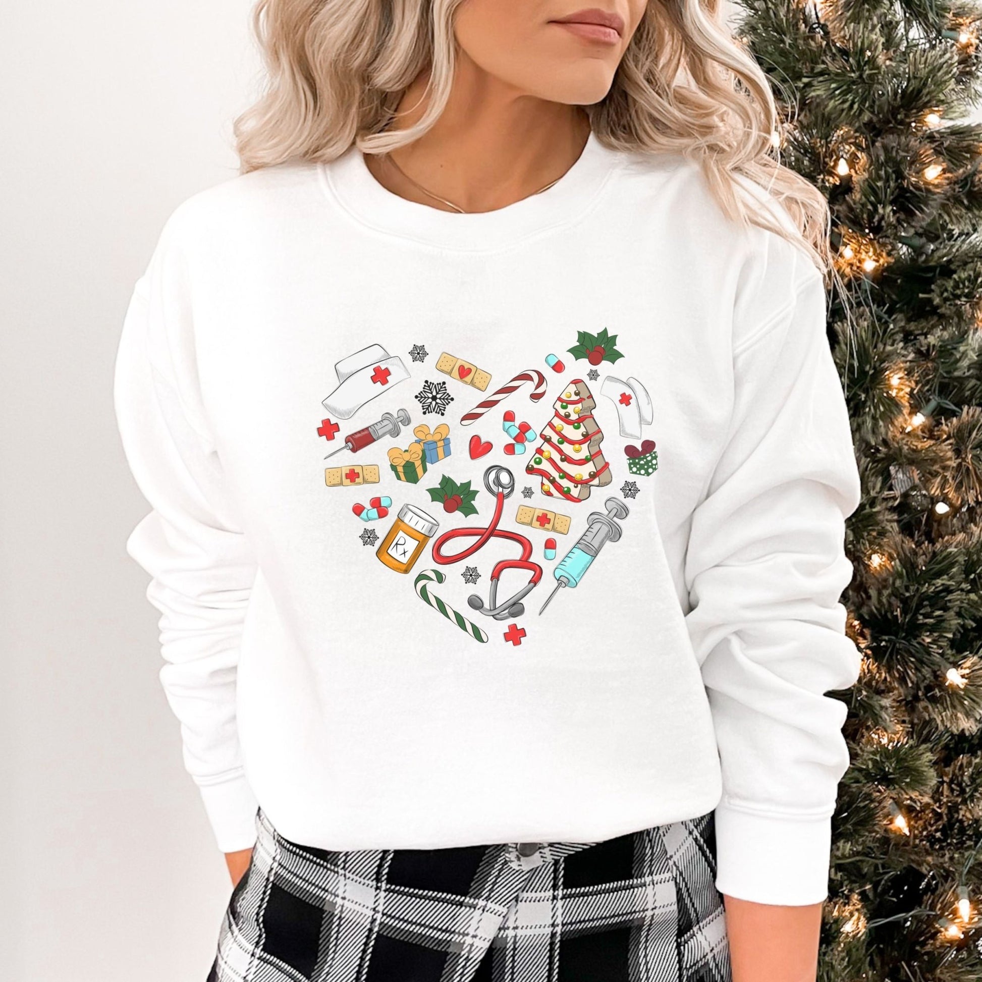 Nurse Christmas sweatshirt with holiday-themed medical icons in a heart shape.