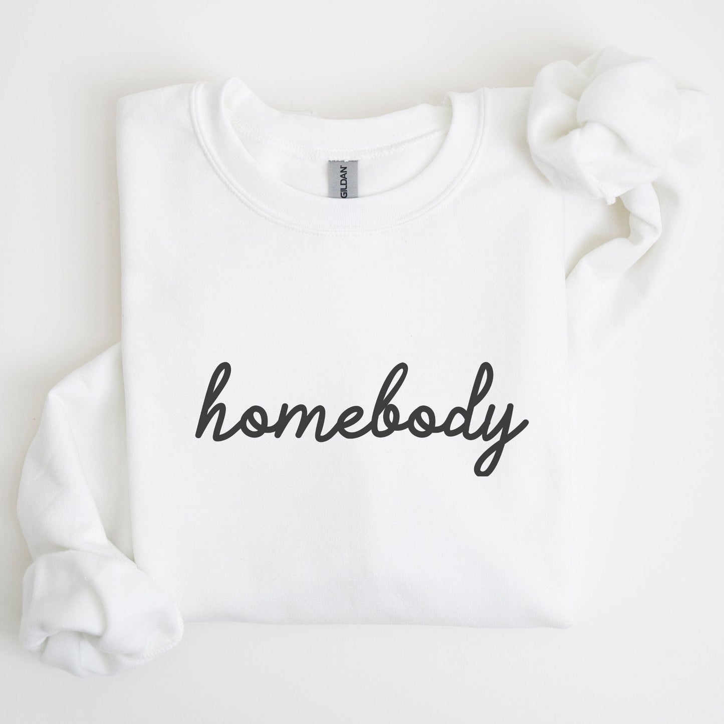 “Homebody” sweatshirt with minimalist script design — cozy neutral crewneck perfect for introverts and lovers of slow days.